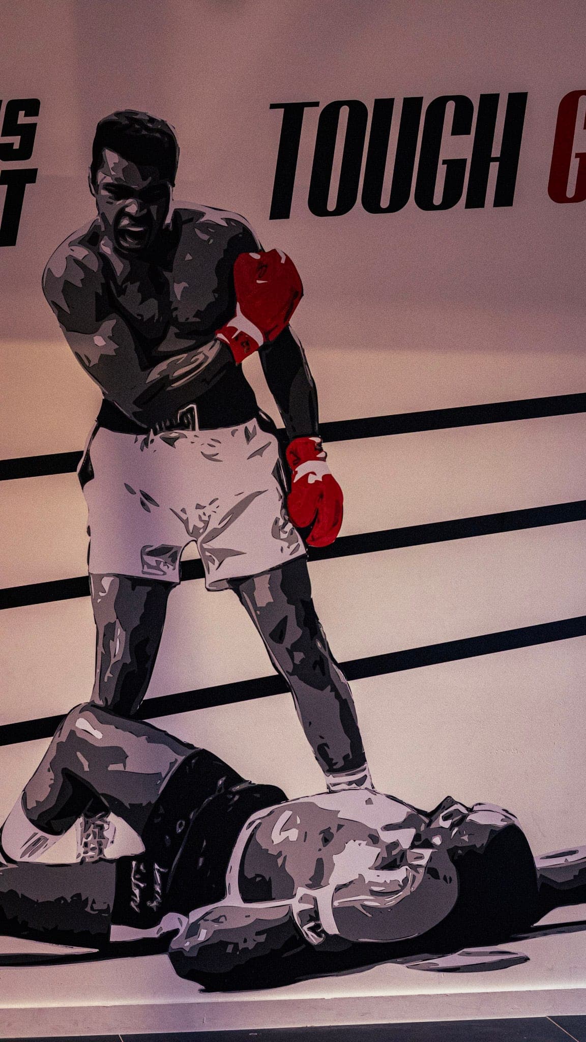 Black-and-white boxing mural on the wall at Tough Glove