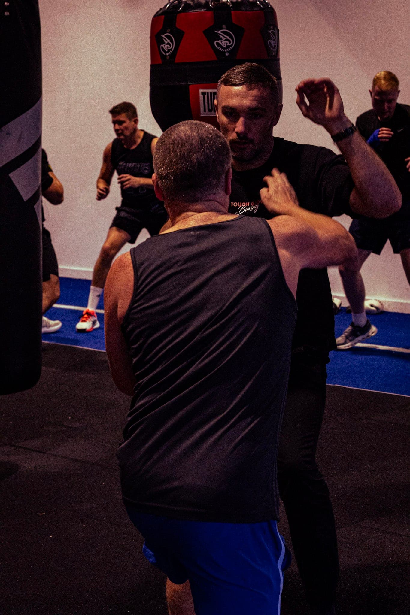 Partner padwork during a busy class