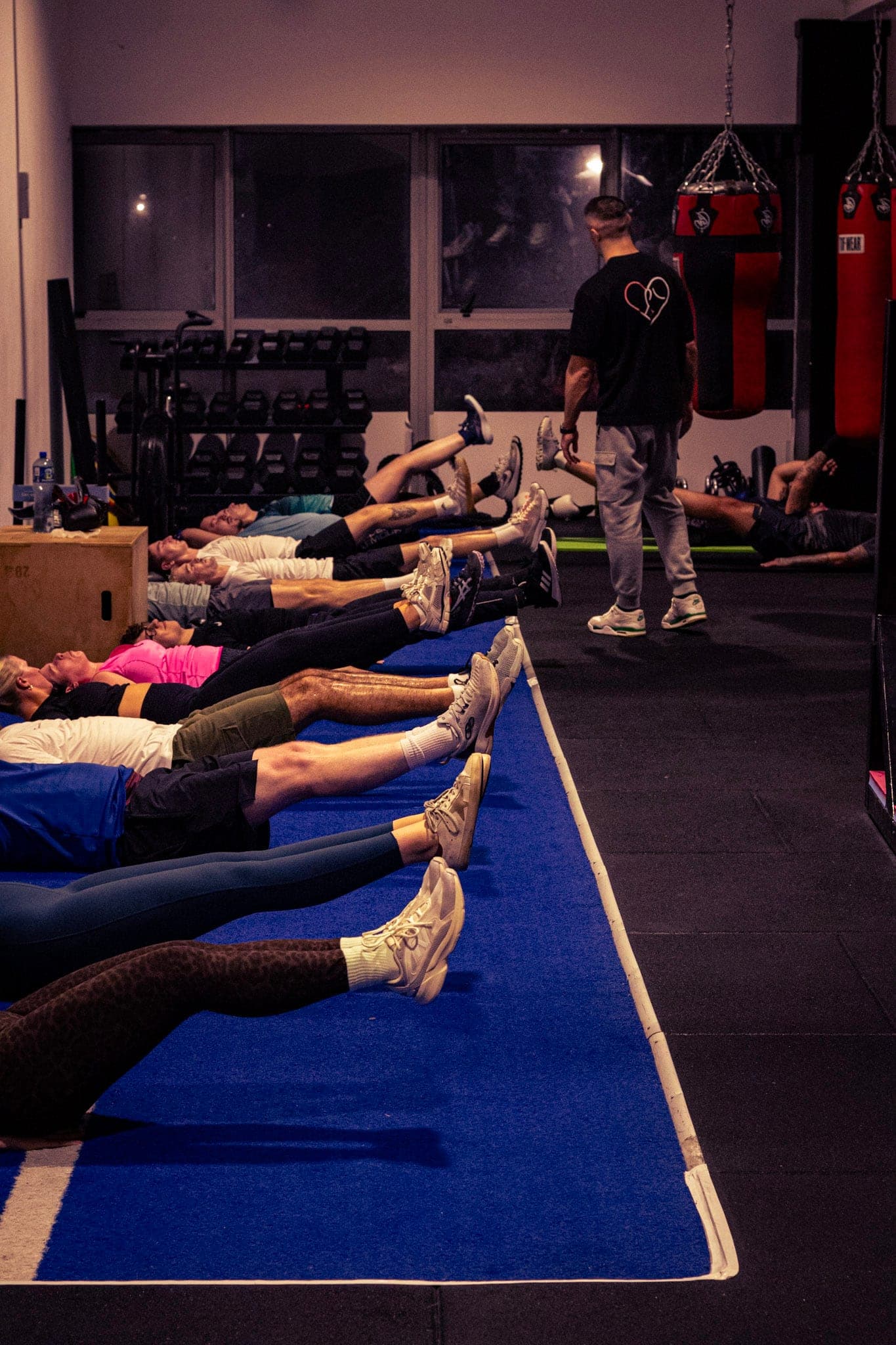 A class doing core work on the mats
