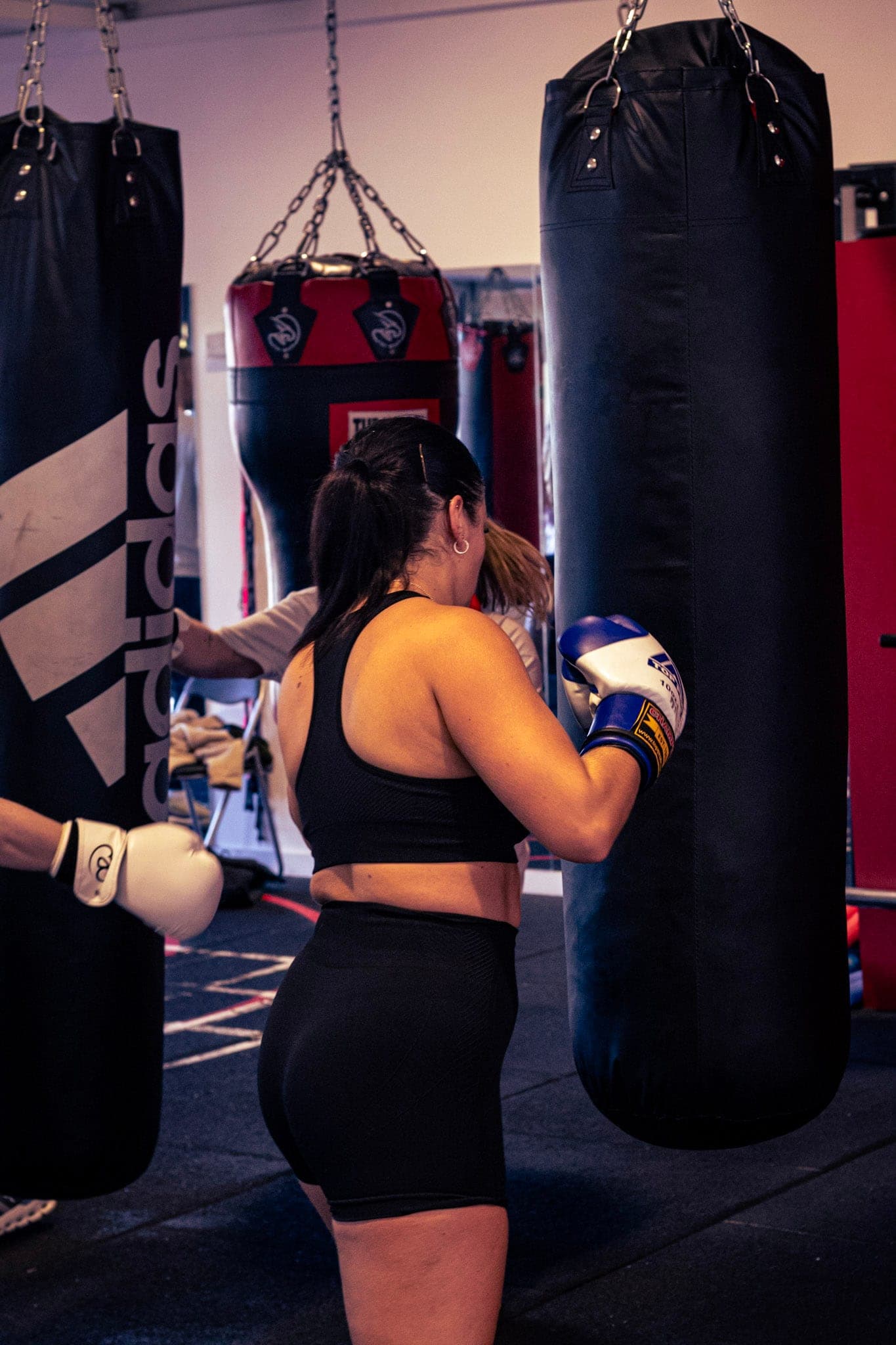 A member working the heavy bag at Tough Glove