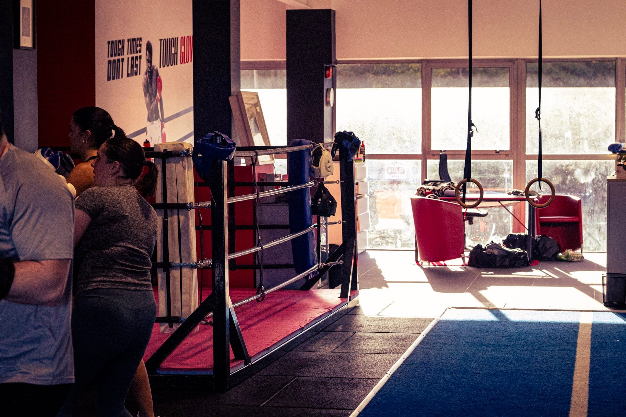 Inside Tough Glove: the boxing ring and training area by the windows