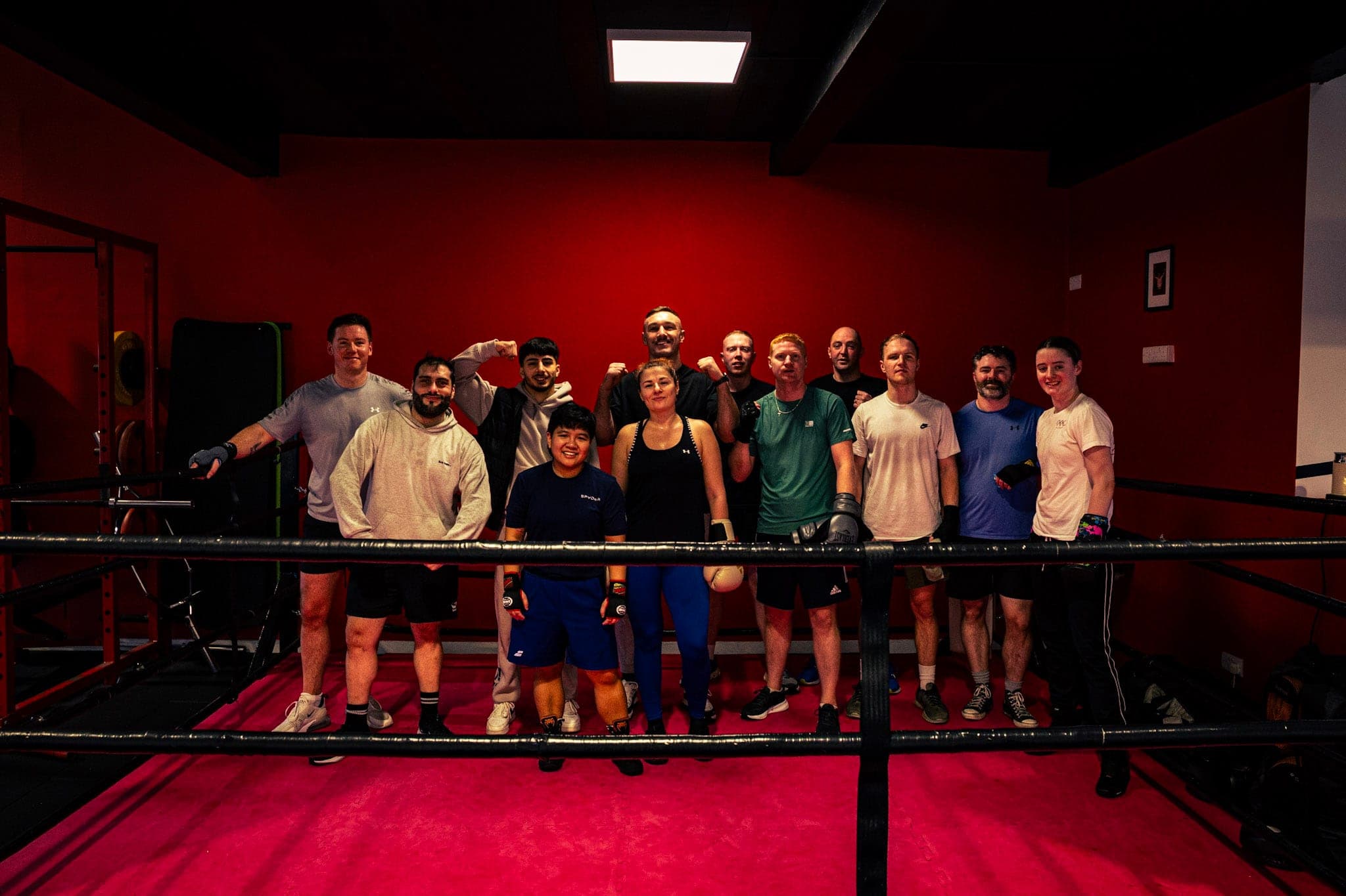 A group of Tough Glove members together in the boxing ring