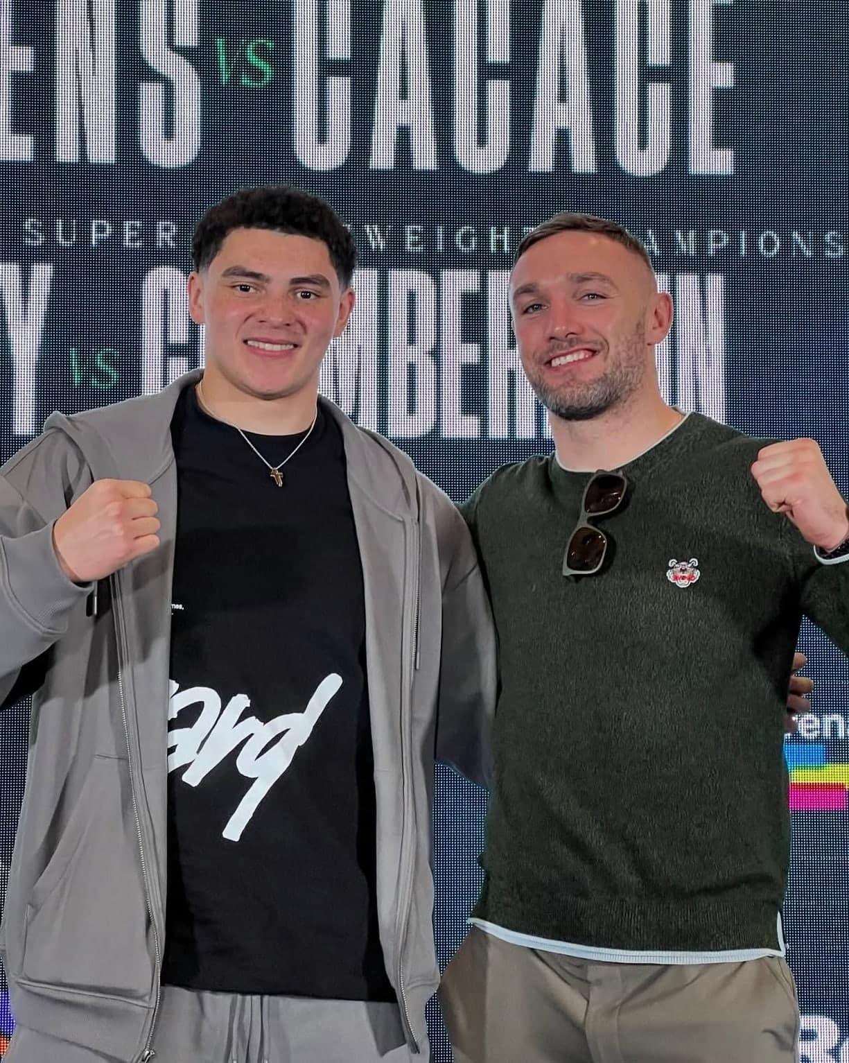 Tony Browne with Adam Olaniyan in front of a fight-night backdrop